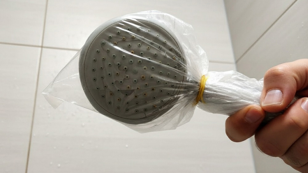 Why You Should Start Putting Your Shower Head in a Bag — Genius!